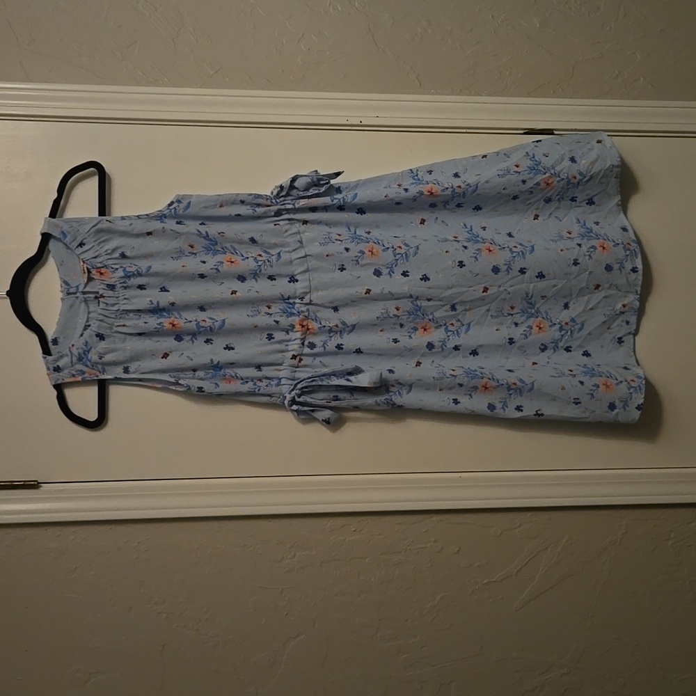 Juicy Couture  size medium dress, colors are light blue & pink flowers and gold